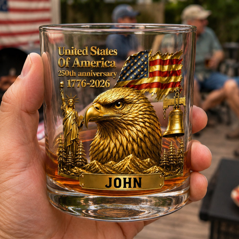 Personalized America 250th Anniversary whiskey glass featuring a golden bald eagle, American flag, Statue of Liberty, Liberty Bell, and custom name for patriotic men and veterans.