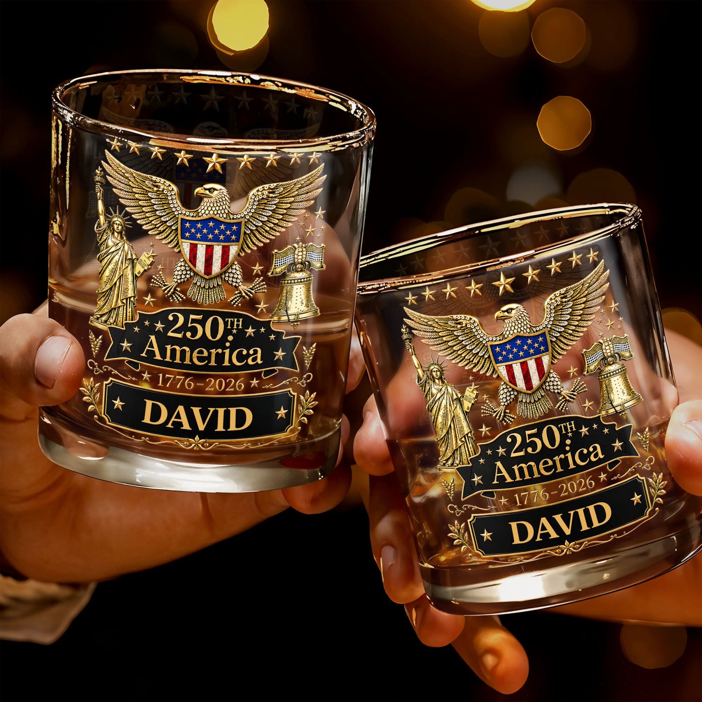 Two hands holding personalized glass tumblers with American-themed designs and text.